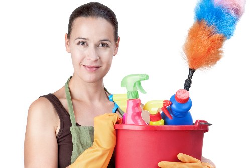 Living room house cleaning with dusting and vacuuming